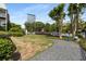 Serene common area featuring a grassy lawn and a stone path, with a view of nearby buildings and lush greenery at 3675 Peachtree Ne Rd # 9, Atlanta, GA 30319