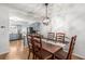 Dining area featuring a wood table with seating and a view into the kitchen at 3675 Peachtree Ne Rd # 9, Atlanta, GA 30319