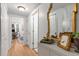 Bright hallway featuring hardwood floors, white trim and doors, leading to a home office area with natural light at 3675 Peachtree Ne Rd # 9, Atlanta, GA 30319