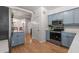 Modern kitchen with stylish cabinetry, stainless steel appliances, and hardwood flooring at 3675 Peachtree Ne Rd # 9, Atlanta, GA 30319