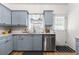 Bright kitchen featuring shaker cabinets, stainless steel dishwasher, and ample counter space at 3675 Peachtree Ne Rd # 9, Atlanta, GA 30319