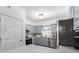 Well-lit kitchen featuring modern appliances and stylish, light-colored cabinetry at 3675 Peachtree Ne Rd # 9, Atlanta, GA 30319