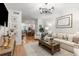 Inviting living room with hardwood floors, comfortable sofa, and dining area visible at 3675 Peachtree Ne Rd # 9, Atlanta, GA 30319