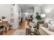 Open-concept living room featuring hardwood floors, sofa, and view to the kitchen and dining space at 3675 Peachtree Ne Rd # 9, Atlanta, GA 30319