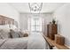 Tranquil main bedroom with soft lighting and a classic wooden dresser and hardwood flooring at 3675 Peachtree Ne Rd # 9, Atlanta, GA 30319