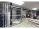 Secured storage units in a basement, featuring chain-link fencing and concrete flooring, offering practical solutions at 3675 Peachtree Ne Rd # 9, Atlanta, GA 30319