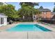 Inviting community pool with a clear blue water, surrounded by brick buildings and lush landscaping at 3675 Peachtree Ne Rd # 9, Atlanta, GA 30319