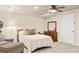 Inviting bedroom with a bed, dresser, and a cozy armchair creating a relaxing retreat at 3720 Bridle Ridge Dr, Suwanee, GA 30024