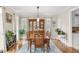 Bright dining room with hardwood floors, elegant décor, and a charming chandelier at 3720 Bridle Ridge Dr, Suwanee, GA 30024