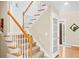 Entryway with stairs and white wood trim at 3720 Bridle Ridge Dr, Suwanee, GA 30024