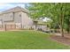 Well-maintained backyard and deck with lush greenery, deck access and a privacy fence at 3720 Bridle Ridge Dr, Suwanee, GA 30024