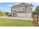Two-story home with a three-car garage, well-kept lawn, and a fenced-in area at 3720 Bridle Ridge Dr, Suwanee, GA 30024