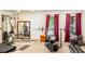 Home gym equipped with weight machines, treadmill, and free weights, ideal for fitness enthusiasts at 3720 Bridle Ridge Dr, Suwanee, GA 30024