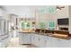 Spacious kitchen with stainless steel appliances, white cabinets, and an open layout at 3720 Bridle Ridge Dr, Suwanee, GA 30024