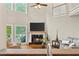 Bright living room with fireplace, ceiling fan, and views to the outdoor deck at 3720 Bridle Ridge Dr, Suwanee, GA 30024