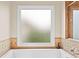 Bright bathroom featuring soaking tub at 3720 Bridle Ridge Dr, Suwanee, GA 30024