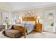 Spacious main bedroom with large windows and sitting area at 3720 Bridle Ridge Dr, Suwanee, GA 30024