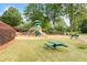 Community playground with slide, swing set and picnic table at 3720 Bridle Ridge Dr, Suwanee, GA 30024