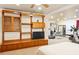 Versatile recreation room combining a lounge area with an entertainment center and a workout space at 3720 Bridle Ridge Dr, Suwanee, GA 30024
