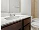 Bathroom vanity featuring modern fixtures, and a tiled shower at 11112 Benton Woods Dr, Covington, GA 30014