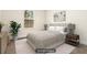 Bright, virtually staged bedroom featuring neutral colors, a large window, and comfortable furnishings at 11112 Benton Woods Dr, Covington, GA 30014