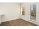 Bright dining area with wood floors and a view of the door at 11112 Benton Woods Dr, Covington, GA 30014