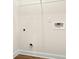 The laundry room features a wire shelf and hookups for a washer and dryer at 11112 Benton Woods Dr, Covington, GA 30014