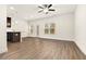 Unfurnished living area featuring wood floors, neutral walls, and ample natural light at 11112 Benton Woods Dr, Covington, GA 30014