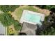 Aerial view of community pool featuring large green trees at 11112 Benton Woods Dr, Covington, GA 30014