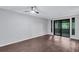 Bedroom featuring hardwood floors, a ceiling fan and sliding glass doors leading to a balcony at 1668 Terrell Ridge Se Dr, Marietta, GA 30067