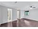 Spacious bedroom with hardwood floors, a ceiling fan, and a large window at 1668 Terrell Ridge Se Dr, Marietta, GA 30067