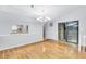 Dining room with wood floors, decorative chandelier, and sliding glass doors at 1668 Terrell Ridge Se Dr, Marietta, GA 30067