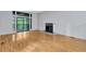 Bright living room featuring hardwood floors, a fireplace, and large glass doors leading to outdoor area at 1668 Terrell Ridge Se Dr, Marietta, GA 30067