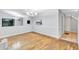 Open-concept living area featuring hardwood floors, vaulted ceilings, and decorative lighting fixtures at 1668 Terrell Ridge Se Dr, Marietta, GA 30067