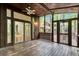 Spacious wood porch with ceiling fan, large windows, and sliding glass doors at 1668 Terrell Ridge Se Dr, Marietta, GA 30067