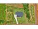 Aerial view of the house with a driveway and large backyard surrounded by trees at 300 Eminence Peak, Rydal, GA 30171