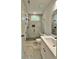 Modern bathroom boasting marble floors, a glass shower, and sleek fixtures for an updated design at 300 Eminence Peak, Rydal, GA 30171