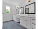 Modern bathroom featuring double vanities, stylish mirrors, and sleek black fixtures at 300 Eminence Peak, Rydal, GA 30171