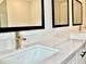 Bright bathroom vanity featuring double sinks with quartz countertops and matte black hardware at 300 Eminence Peak, Rydal, GA 30171
