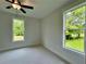 Bright, airy bedroom with scenic backyard views from large windows, creating a peaceful retreat at 300 Eminence Peak, Rydal, GA 30171