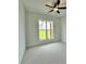 Bright bedroom with plush carpet and ceiling fan, offers a serene view of outdoors at 300 Eminence Peak, Rydal, GA 30171