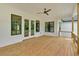 Large rear wood deck featuring a ceiling fan, and a view of the yard at 300 Eminence Peak, Rydal, GA 30171