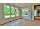 Bright dining area featuring large windows with natural light and hardwood flooring at 300 Eminence Peak, Rydal, GA 30171