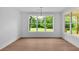 Light filled dining area featuring large picture window with backyard view at 300 Eminence Peak, Rydal, GA 30171