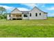 Expansive backyard showcasing the home's rear exterior and a well-maintained lawn at 300 Eminence Peak, Rydal, GA 30171