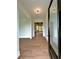 Bright foyer with hardwood floors, modern lighting, and an open view into the living spaces at 300 Eminence Peak, Rydal, GA 30171