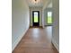 Bright entryway with hardwood floors and natural light showcasing the home's welcoming ambiance at 300 Eminence Peak, Rydal, GA 30171