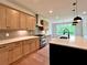 Kitchen featuring stainless steel appliances, modern countertops, and wood cabinets at 300 Eminence Peak, Rydal, GA 30171