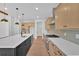 Spacious kitchen with stainless appliances, center island, and butler's pantry at 300 Eminence Peak, Rydal, GA 30171