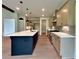 Modern kitchen featuring a central island, stainless steel appliances, and ample cabinet space at 300 Eminence Peak, Rydal, GA 30171